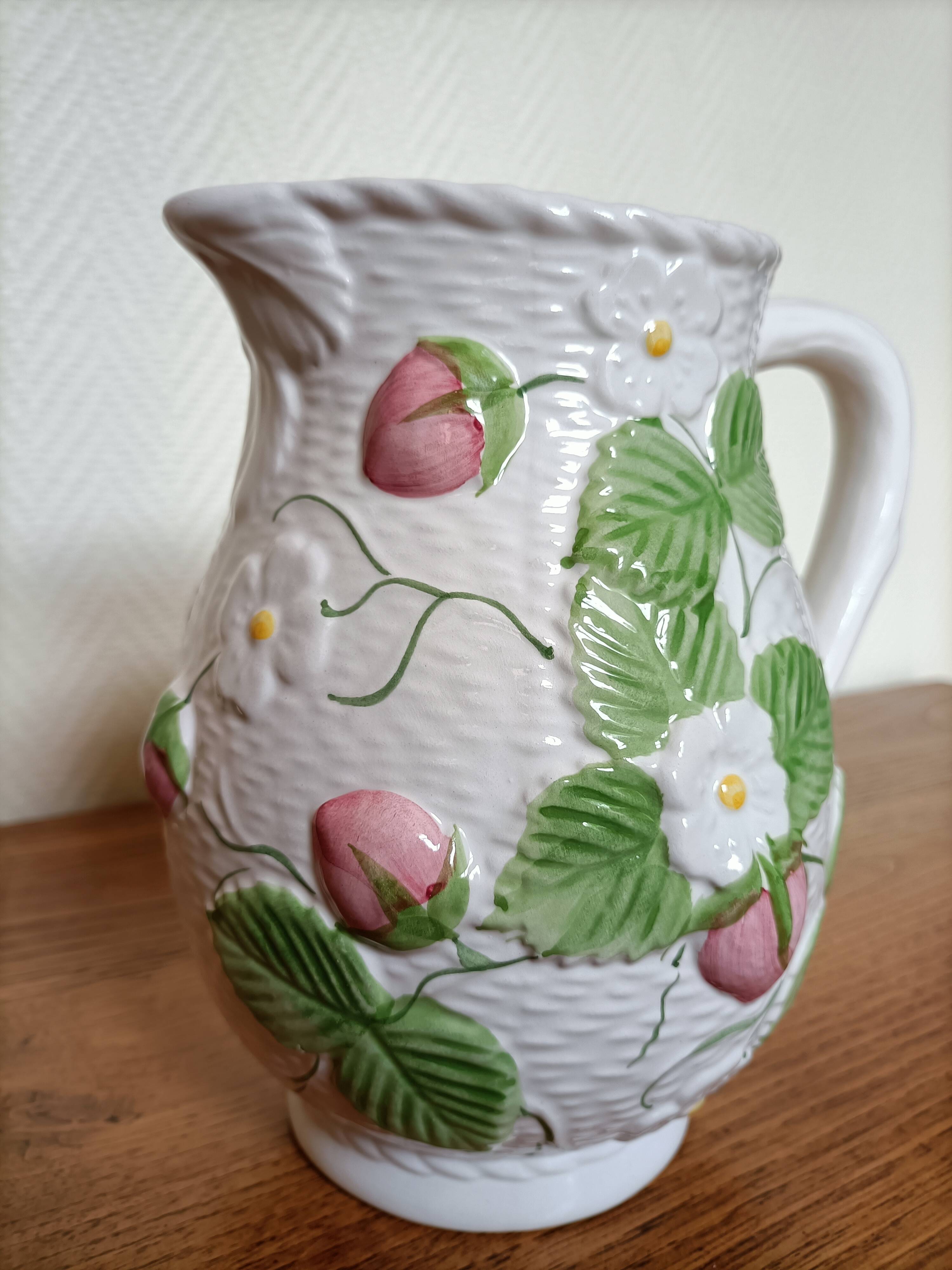 Barbotine pitcher with pastel flower decoration