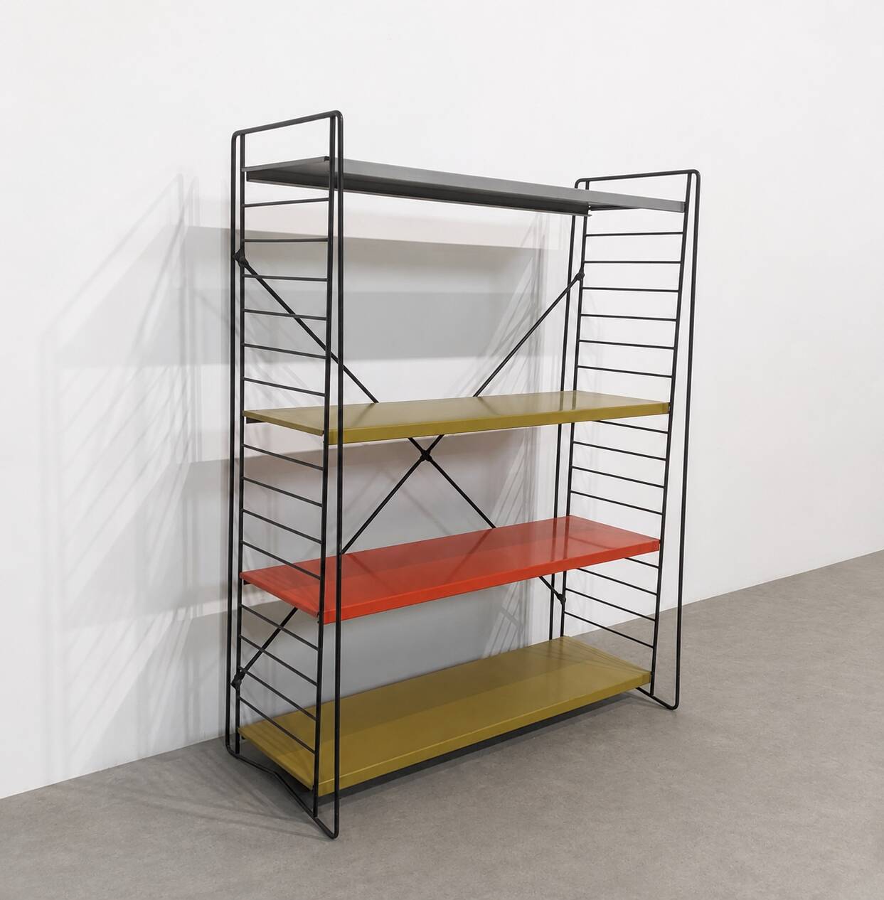 Vintage metal Tomado shelf to place