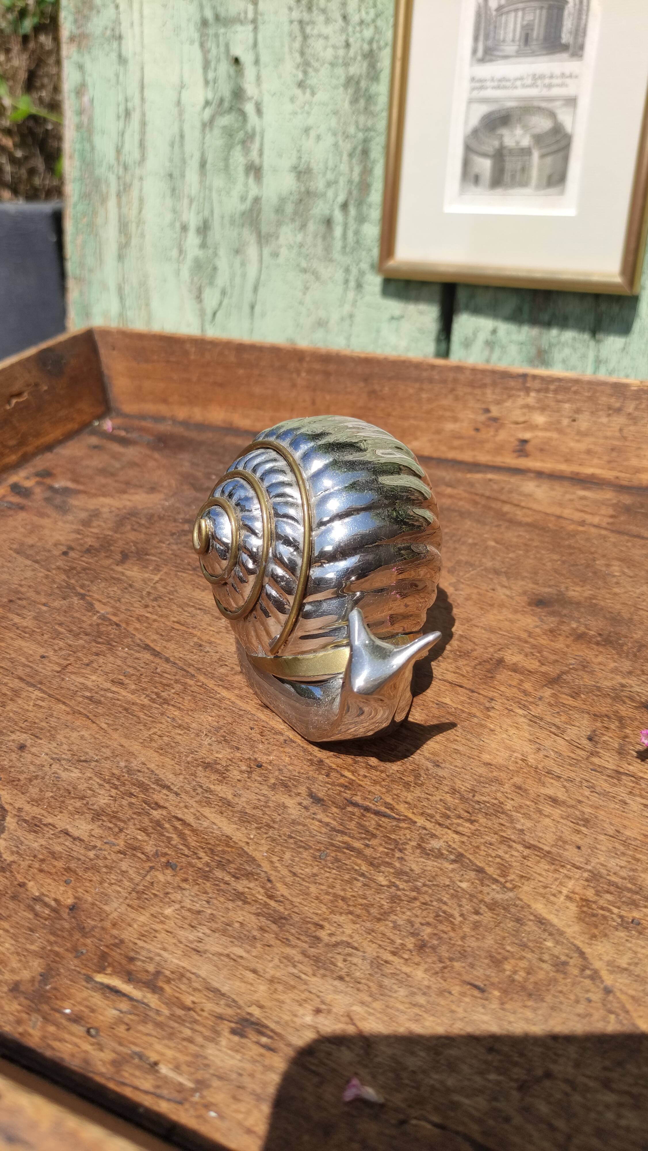 Vintage ashtray in silver and gold metal in the shape of a snail