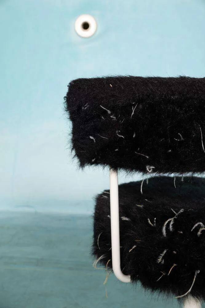 Space age design armchair from the sixties, fluffy stool with trumpet base.