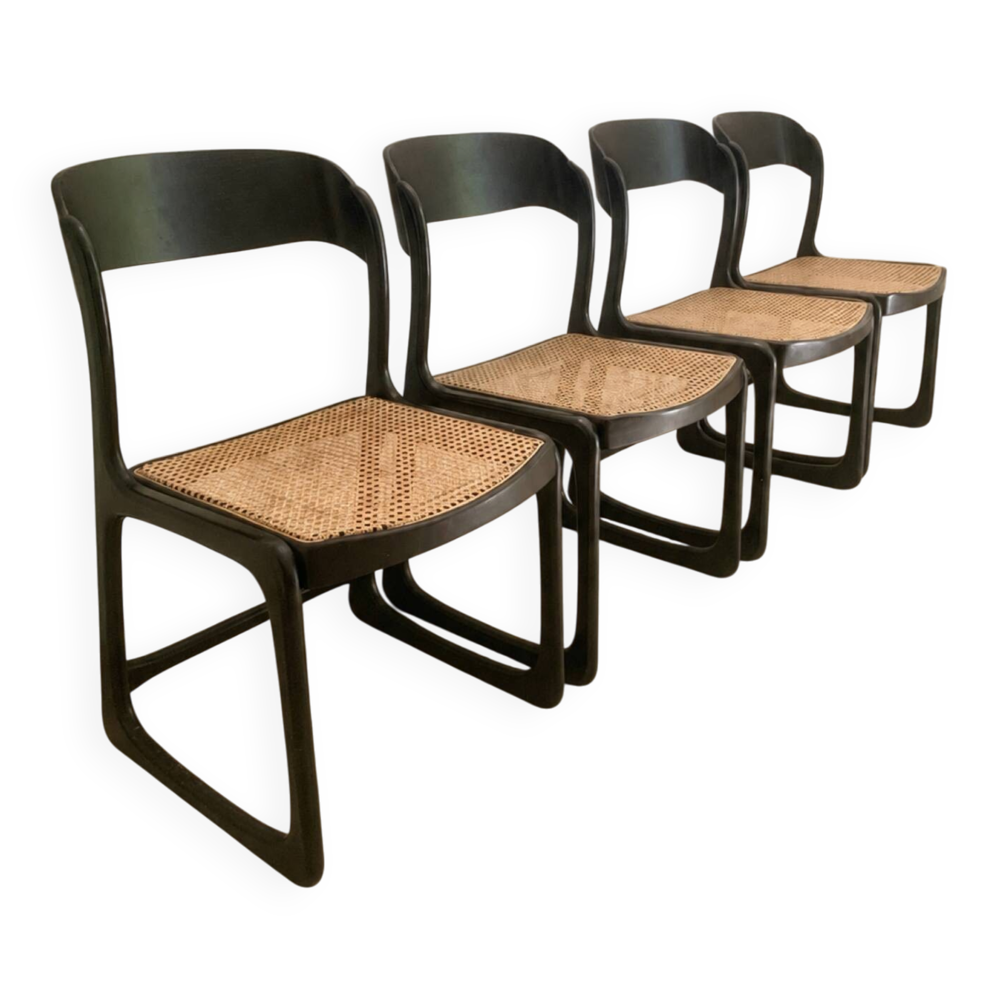 Set of 4 Baumann sled chairs with caning.