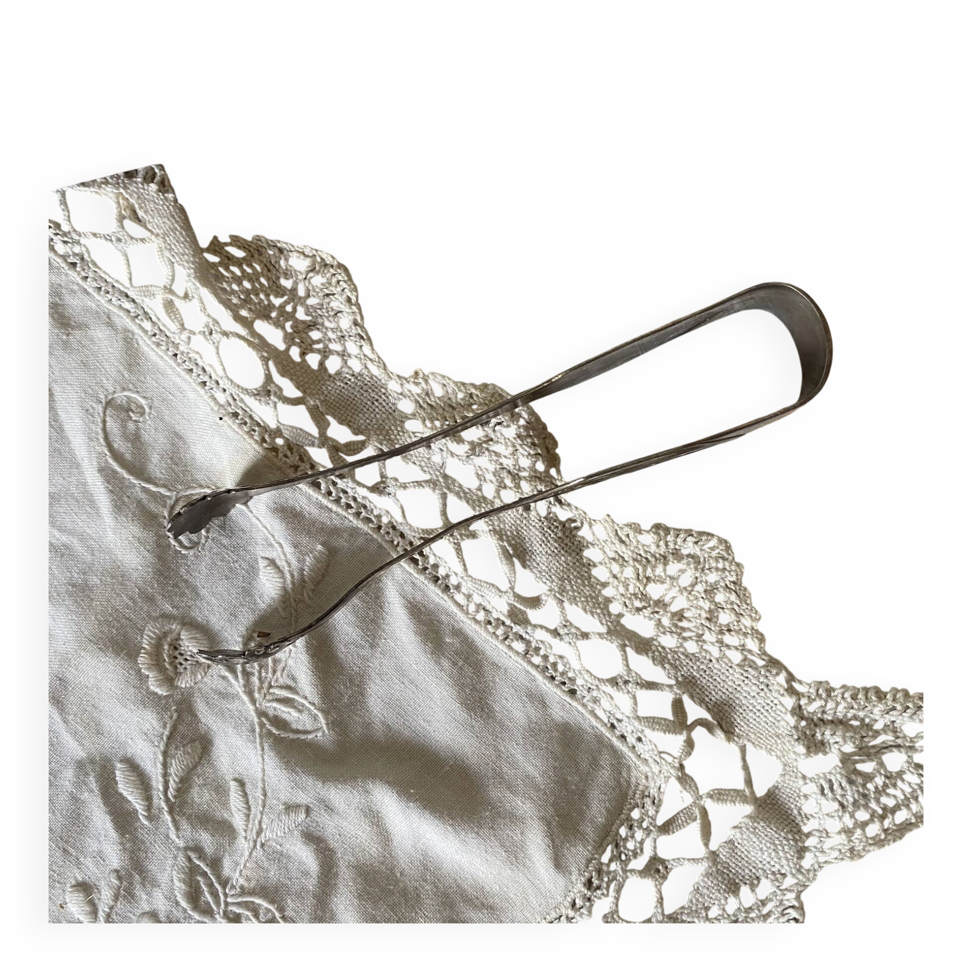 Antique sugar tongs in its case, shell decoration.