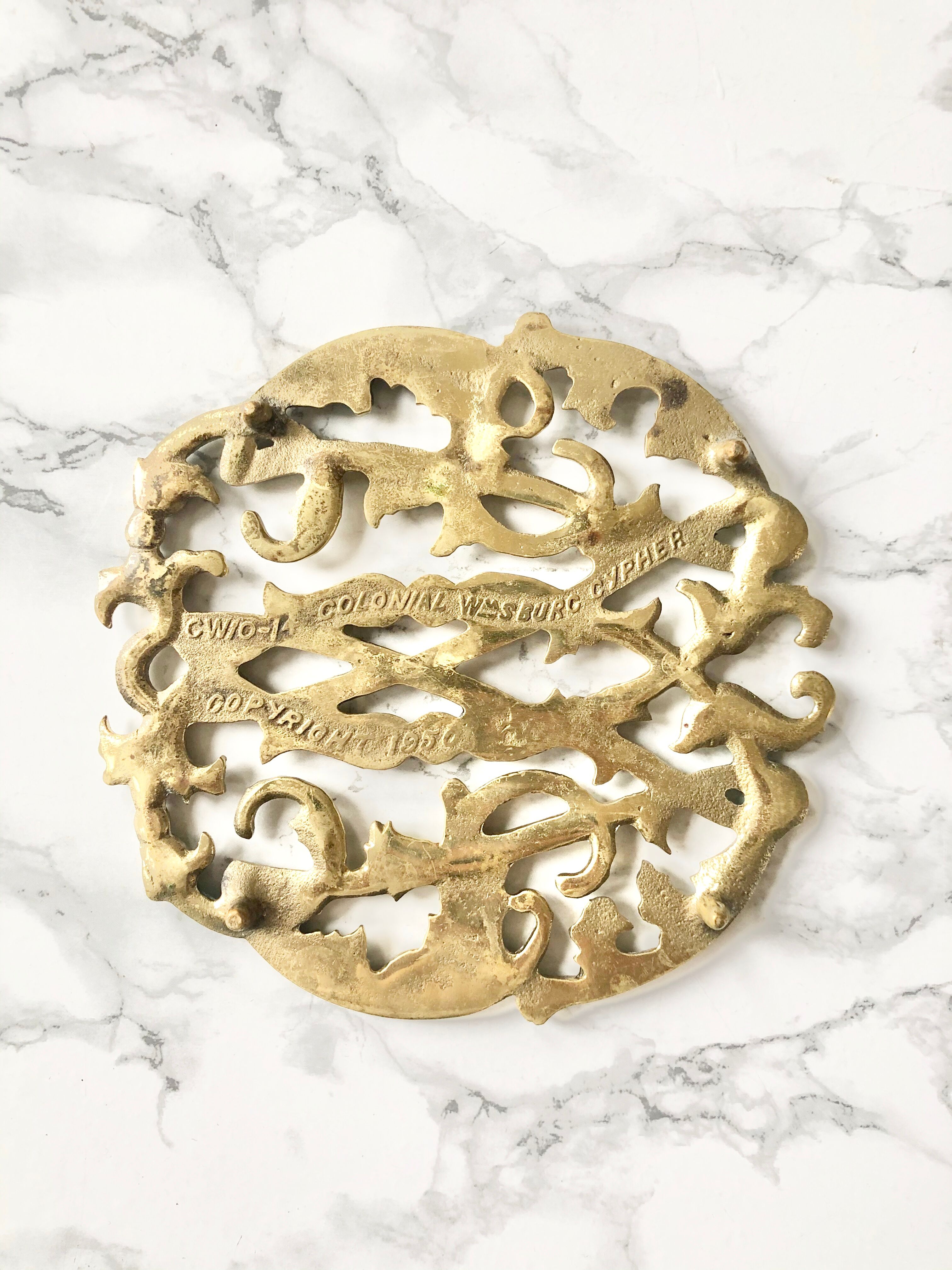 Underside of old solid brass dish, american manufacture Virginia Metalcrafters