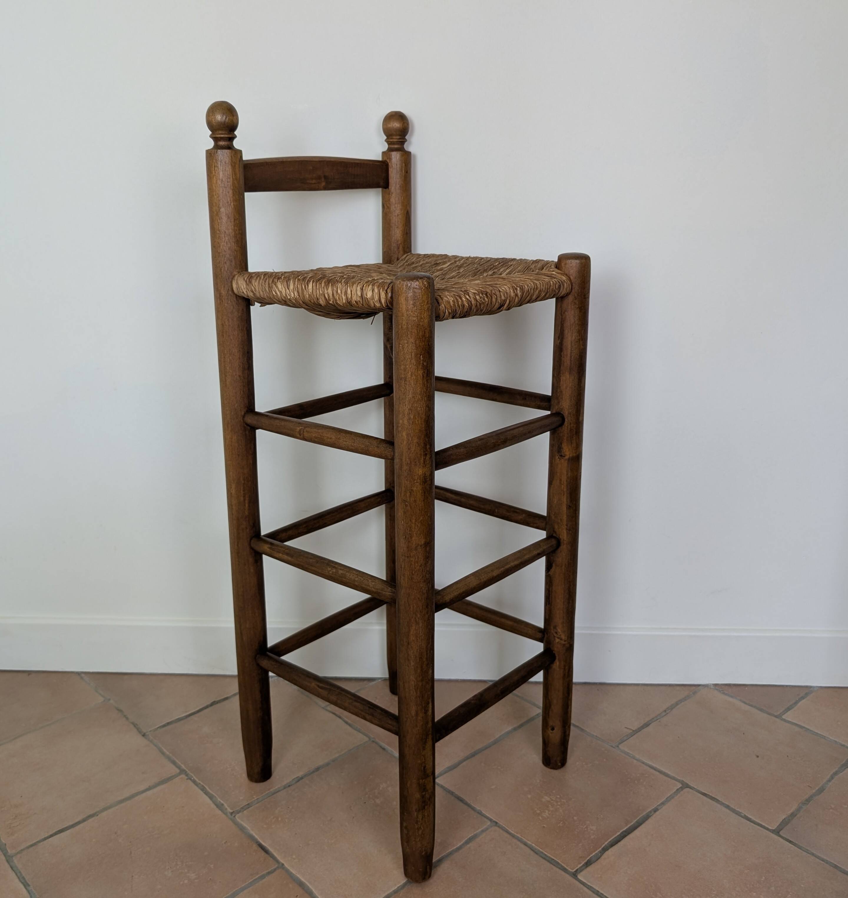 High wooden and straw stools