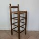 High wooden and straw stools