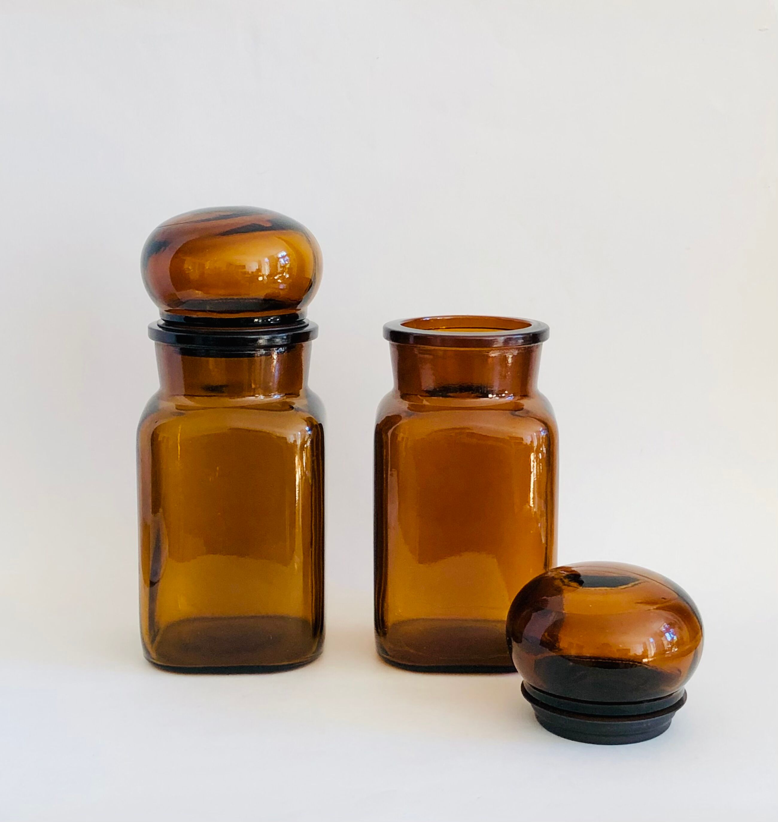 Pair of vintage amber glass jars
