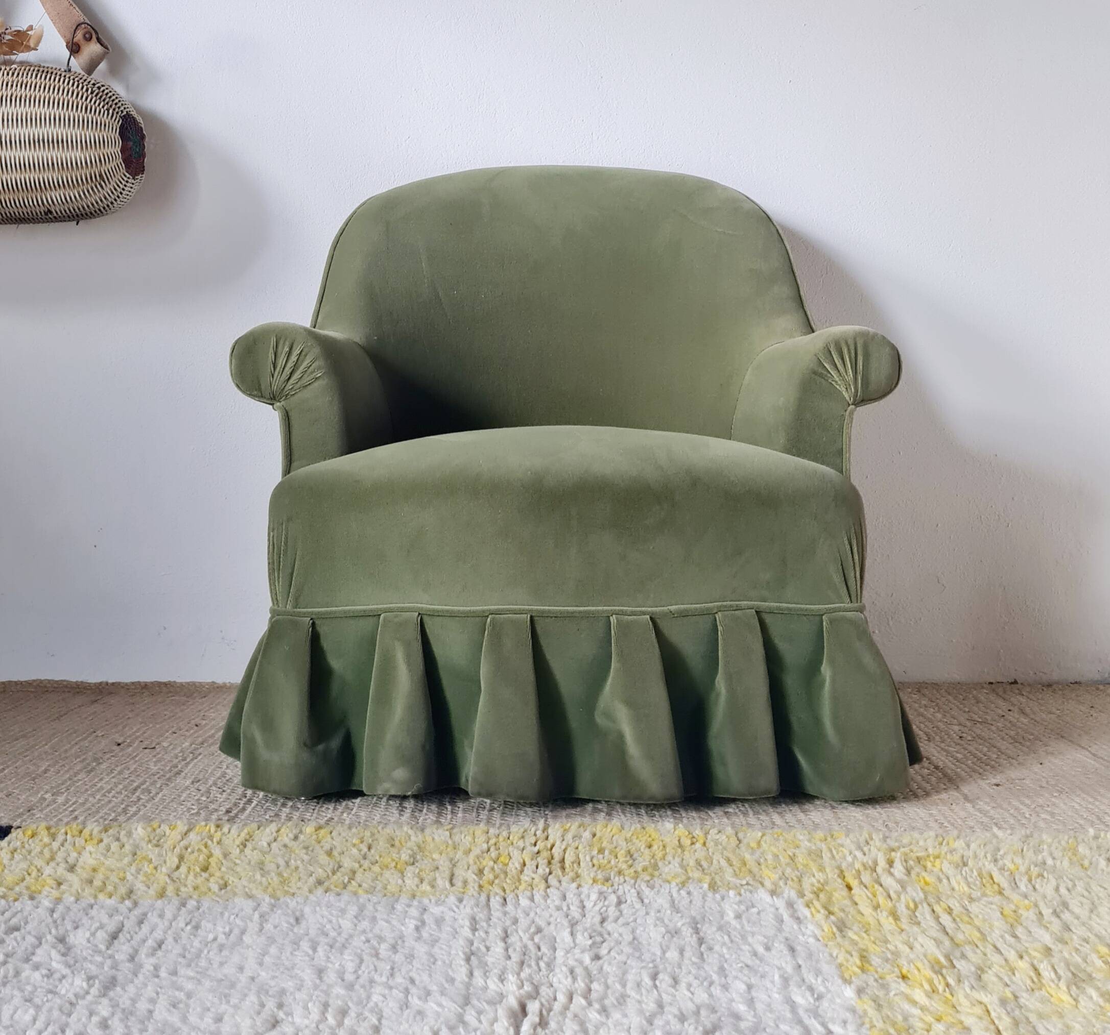 Green velvet armchair