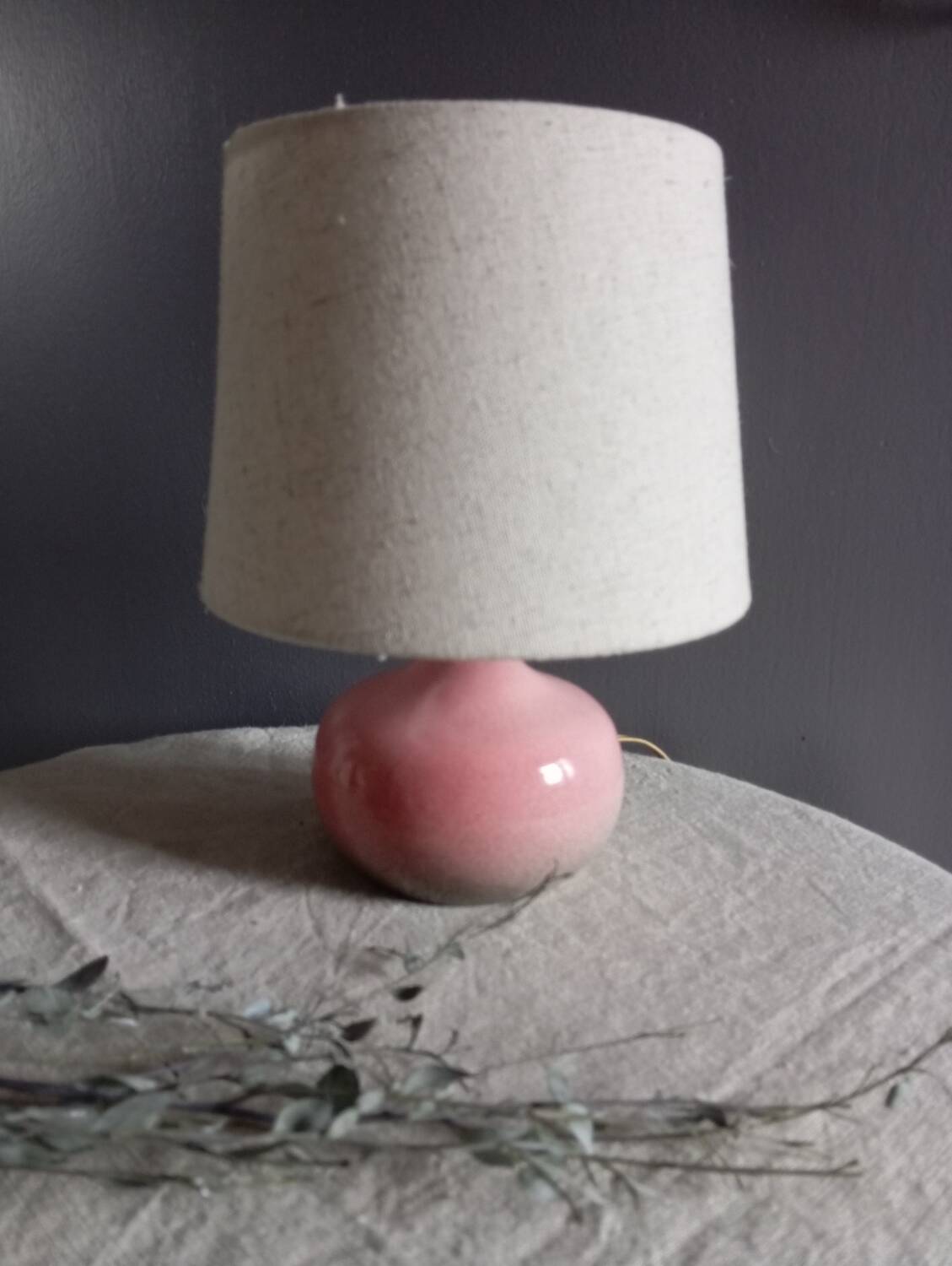 Signed speckled pink ceramic bedside lamp, linen lampshade