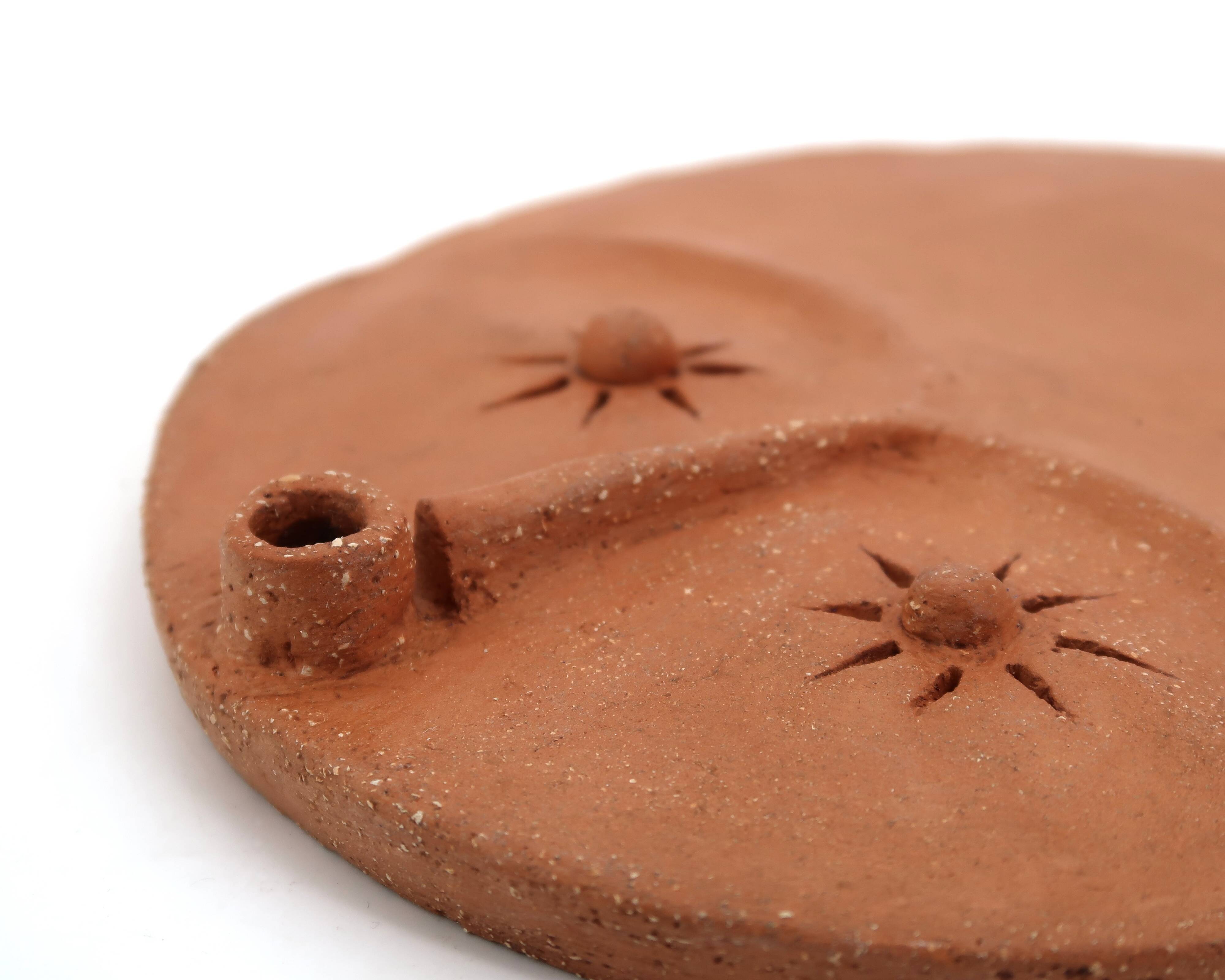 Round ceramic wall mask inspired by Africa, 1980s.