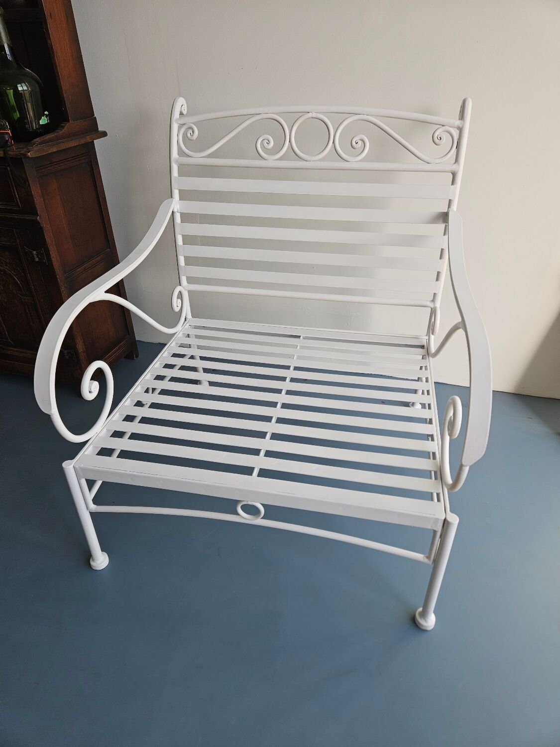 Robust wrought iron armchair