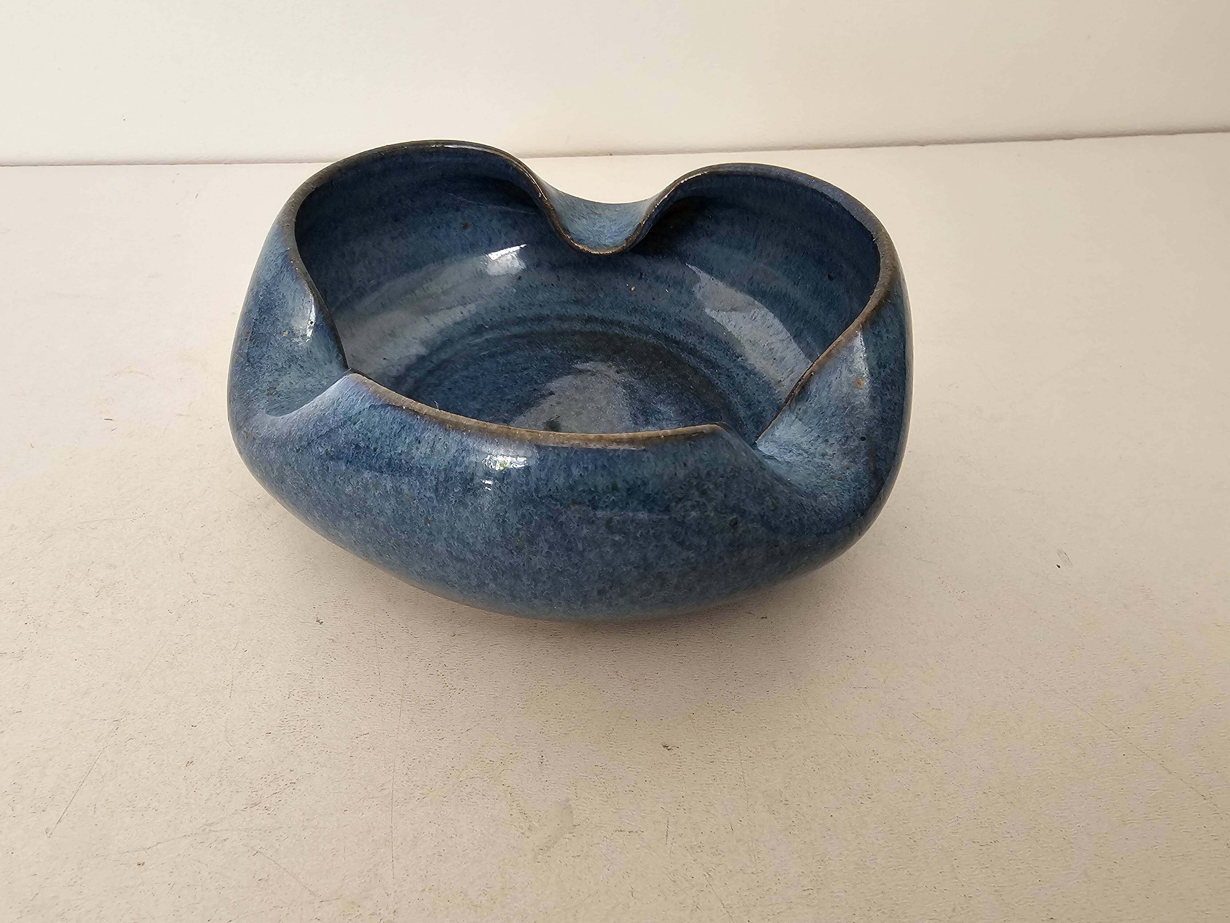 Blue ceramic catchall ashtray in a free form, signed CH.