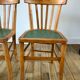 Pair of bistro chairs in light curved wood and green seat 1950s