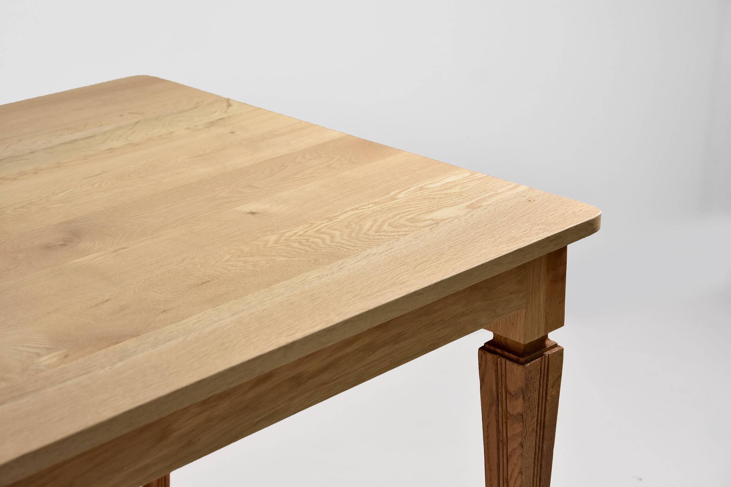 Vintage solid oak table with antique legs.