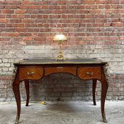 Antique French-style desk with green leather top and bronze mounts