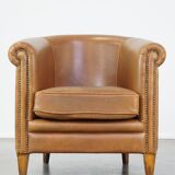 Sheep leather club chair in neutral cognac colour and in good condition