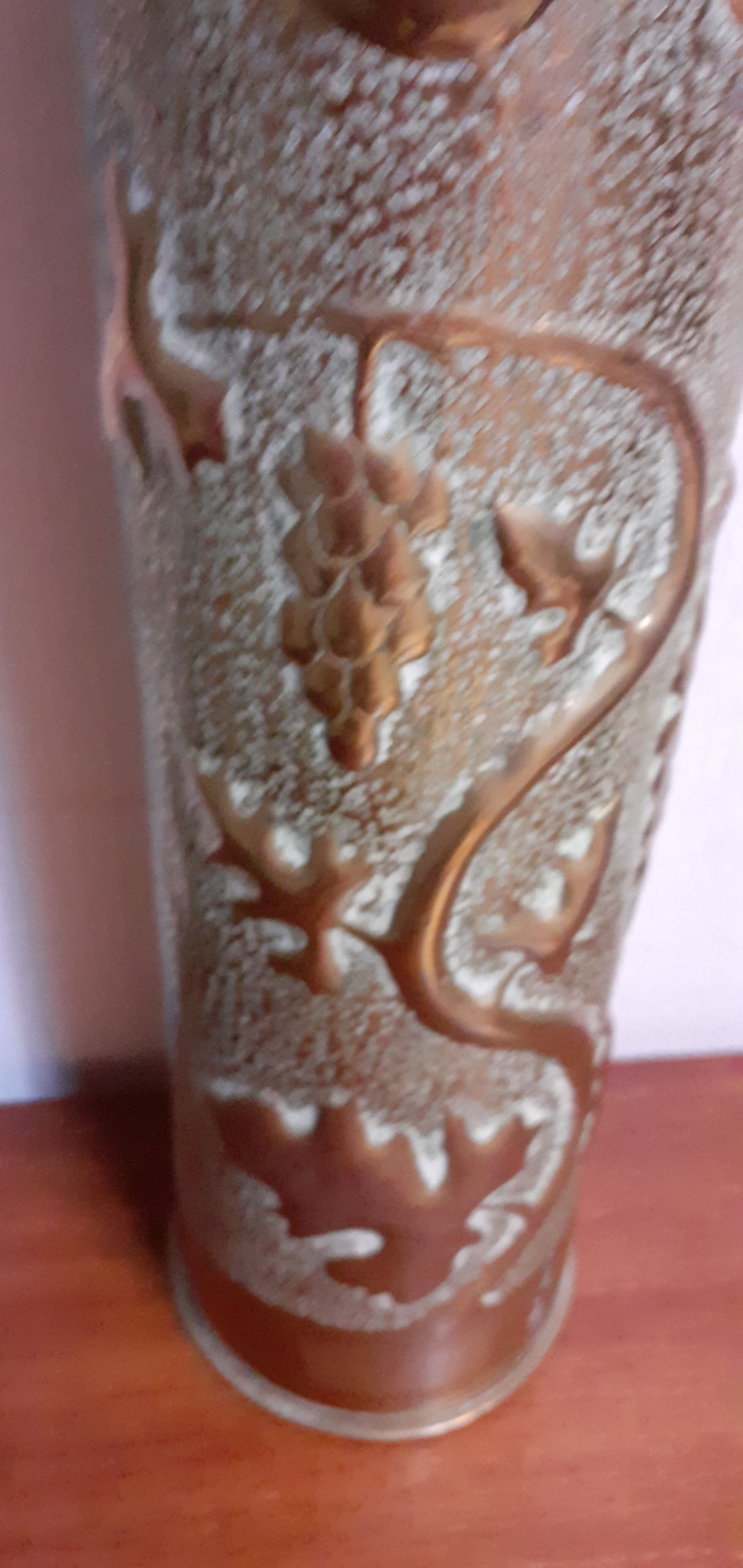Shell casing vase carved into the trenches