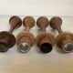Four Scandinavian-style wooden candle holders