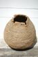 Old basket, burgundy straw and bramble, woven basket, interior decoration, pantry, flowerpot