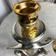Pair of silver and gold metal candlesticks