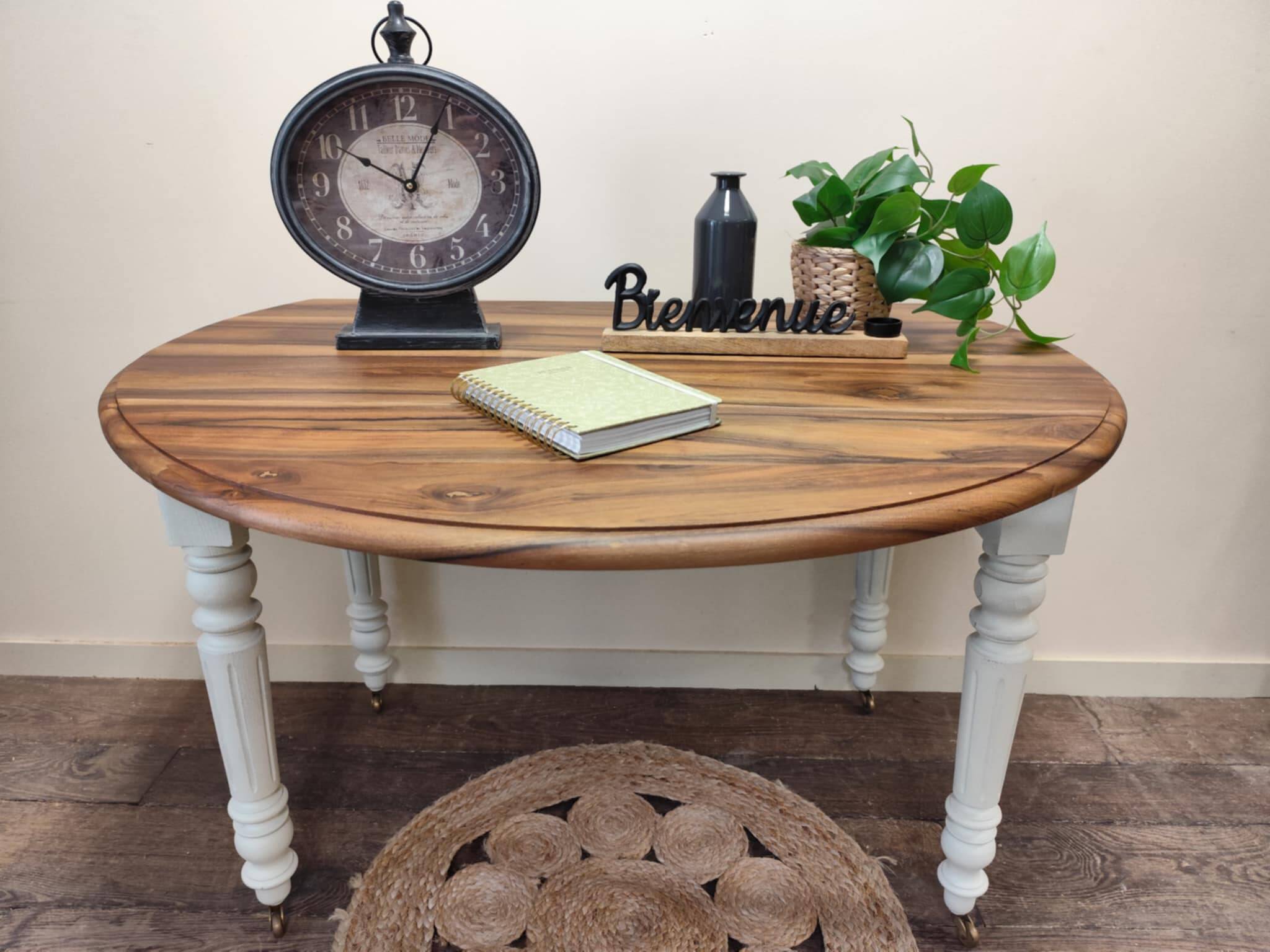 Round walnut table convertible into a console.