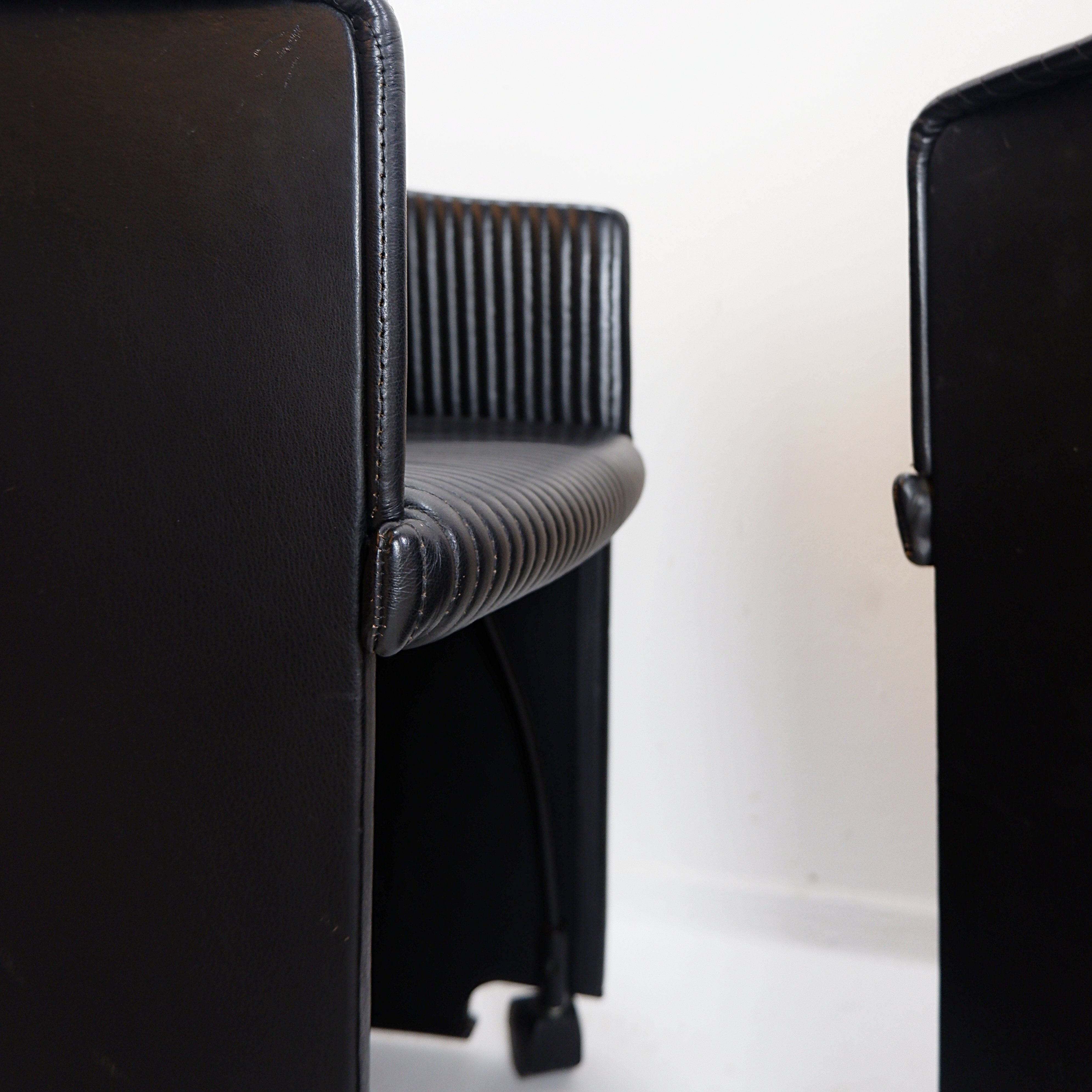 Pair of Artona armchairs in black leather by Afra and Tobia Scarpa for Maxalto