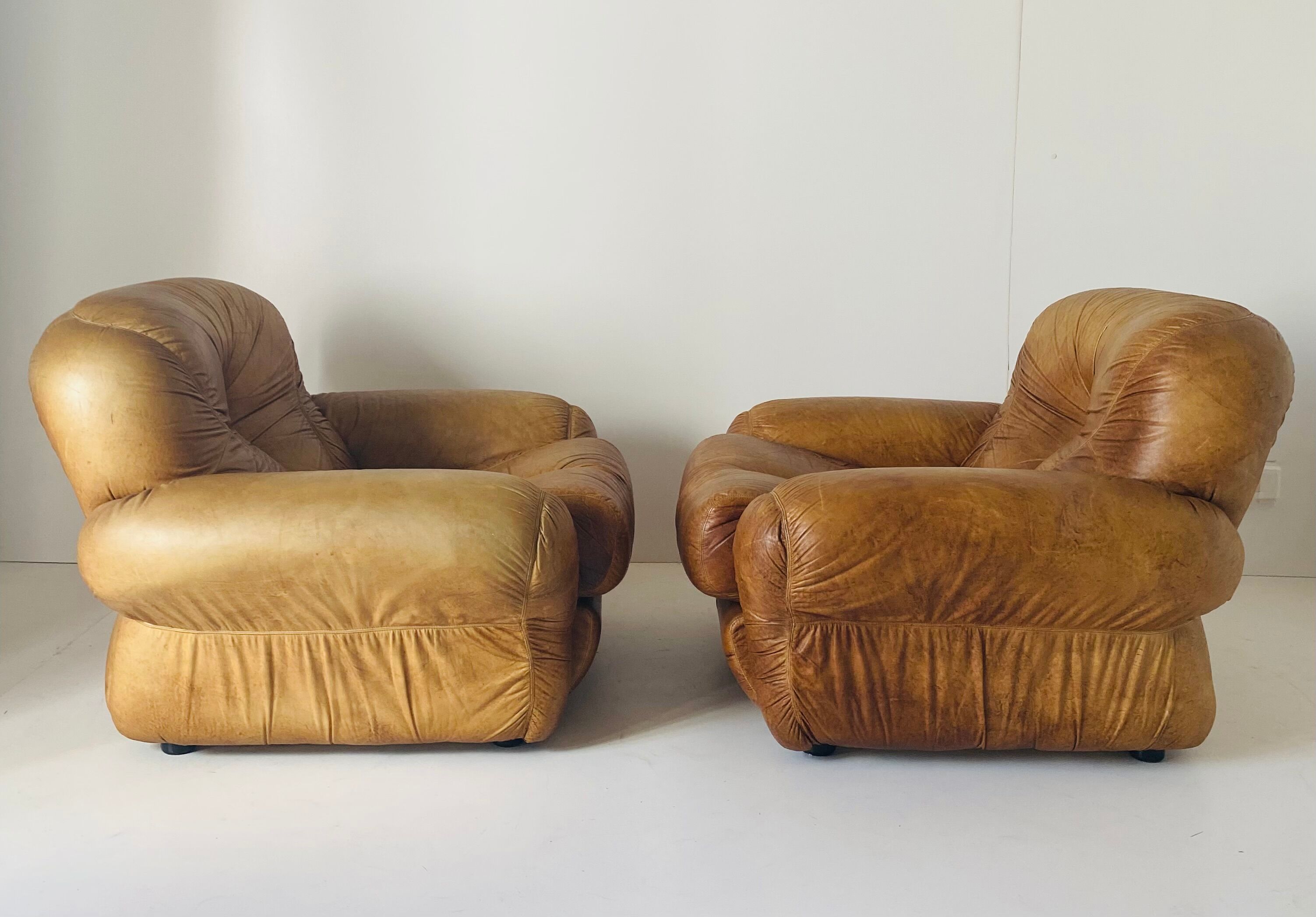 Pair of brown leather armchairs