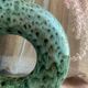 Handmade terracotta donut vase in light green terracotta