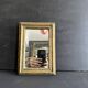 Miniature mirror from the 18th century in gilded wood, mercury glass.