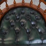 Dark green chesterfield office chair in cowhide leather on wheels