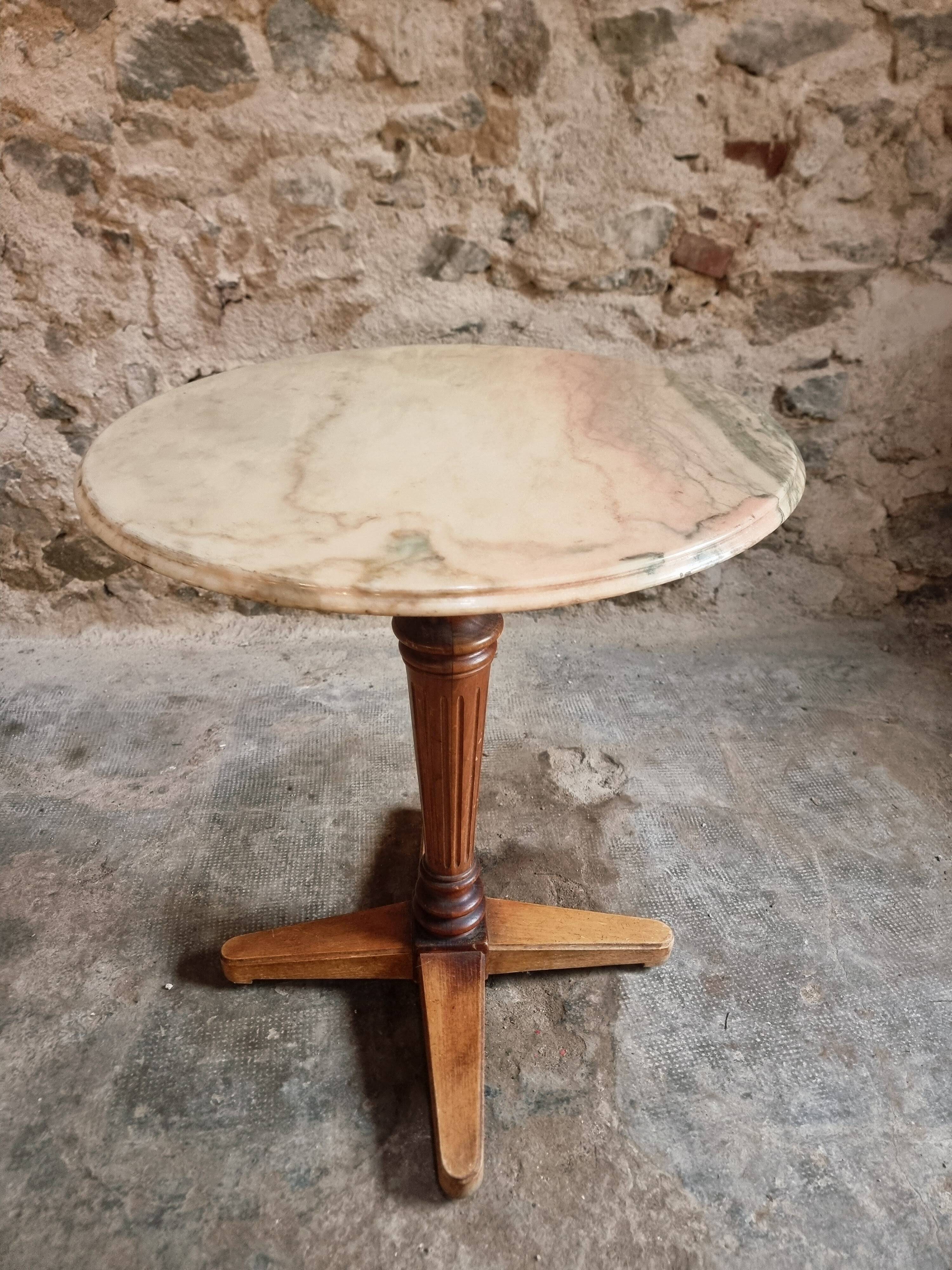 Vintage French bistro table in marble, walnut base, from 1920–1940.