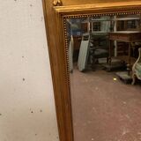 Miroir de style Louis XVI en bois et stuc doré XX siècle