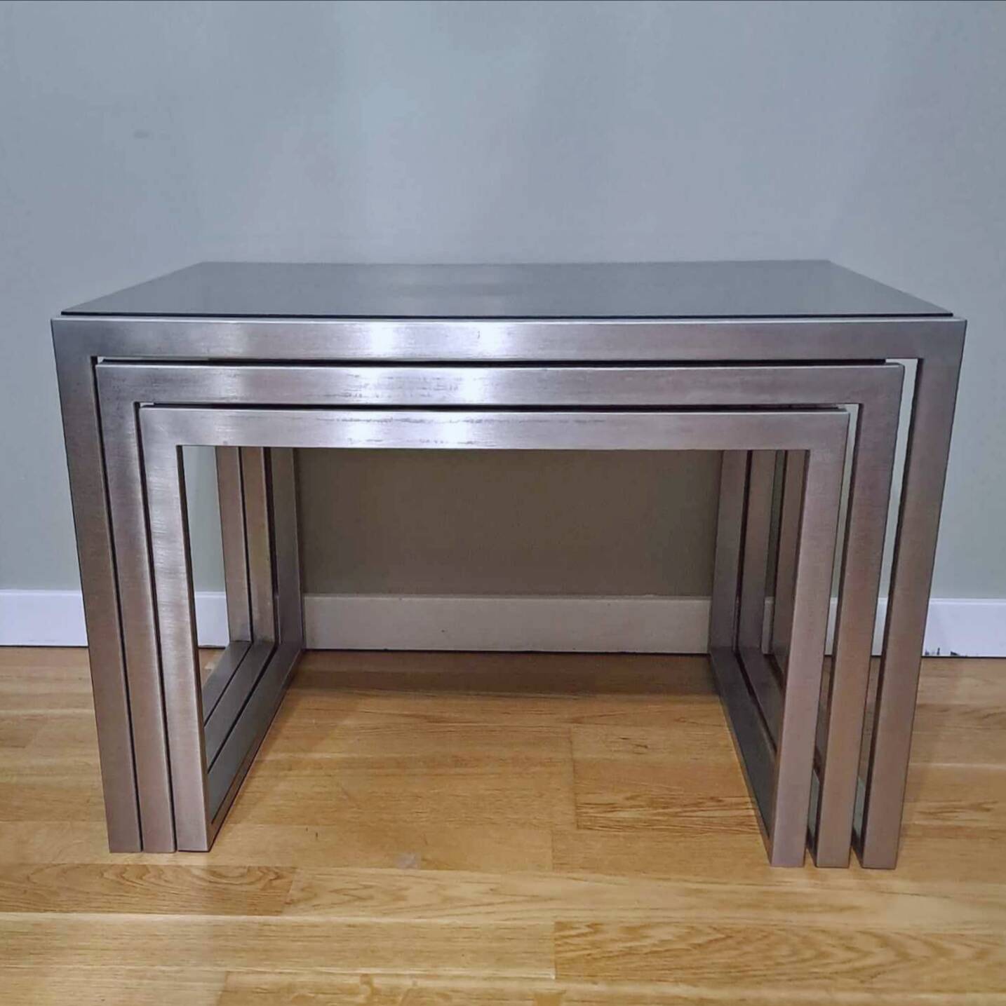 Chrome and smoked glass designer nesting table