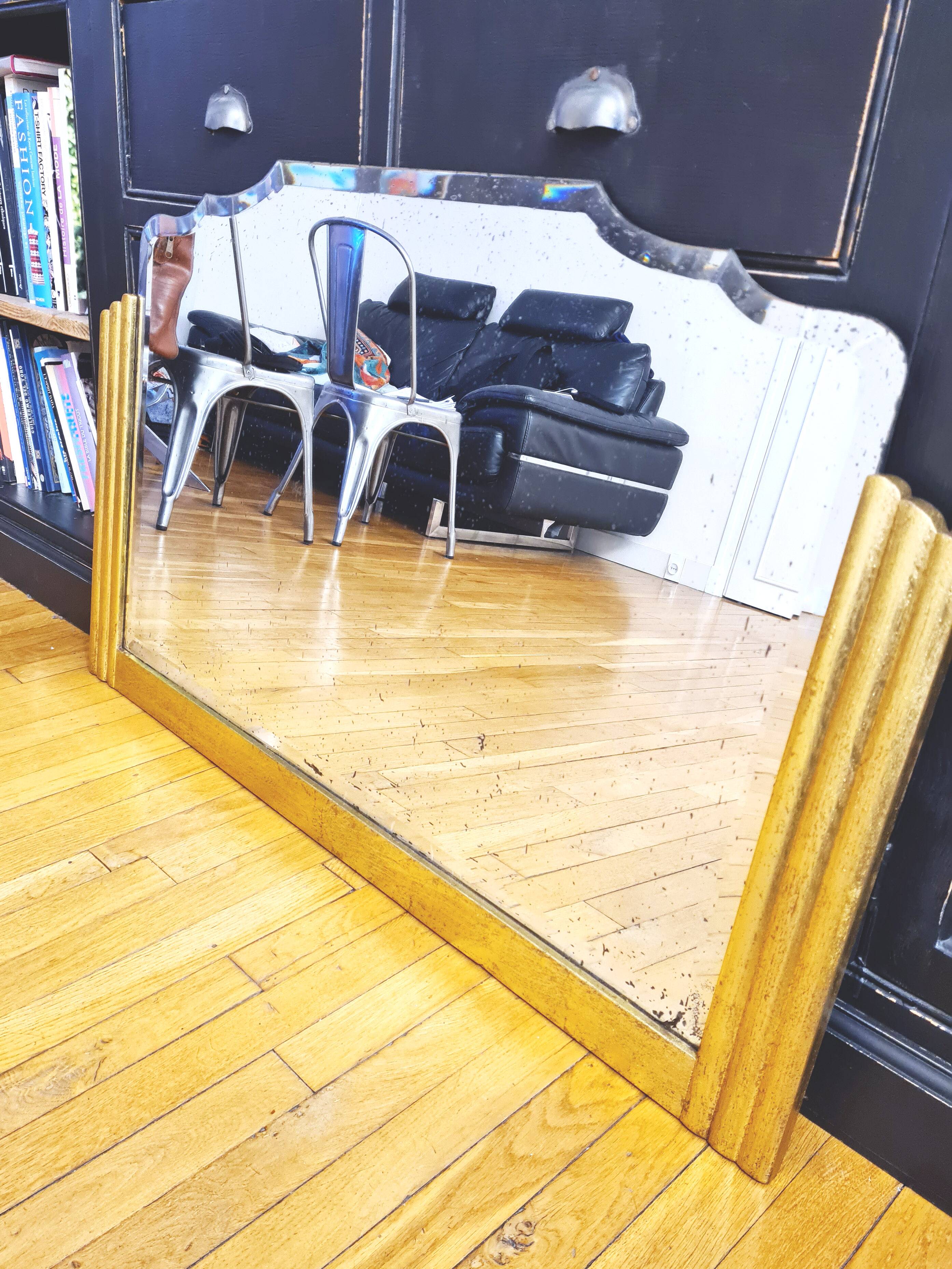 Antique large beveled mercury pediment mirror, art deco, gilded with leaf.