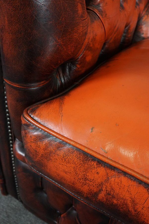 Chesterfield sofa in patinated orange leather, 2.5 seats
