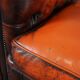 Chesterfield sofa in patinated orange leather, 2.5 seats