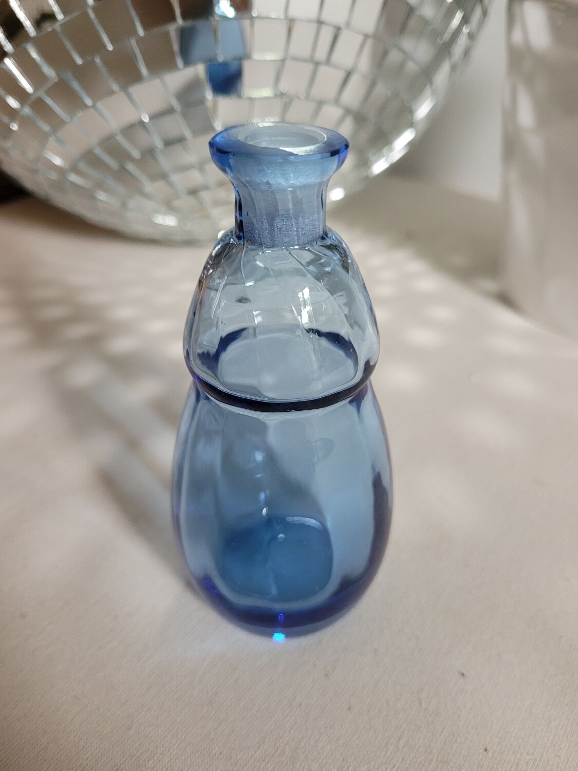 Small blown blue glass bottle