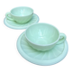 Two green opaline cup and saucer sets.