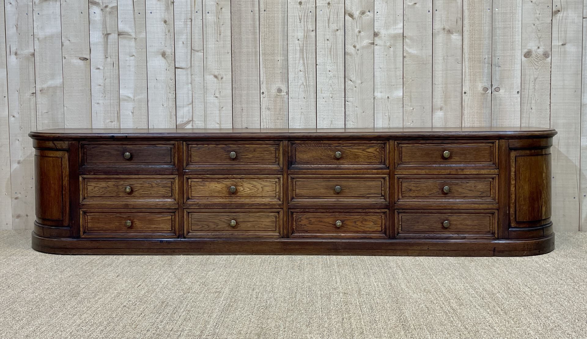 Long low oak countertop with 12 drawers - early XXth