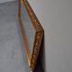 wall mirror in a decorative wooden frame.