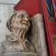 Book-clamps couple of realistic old men in plaster