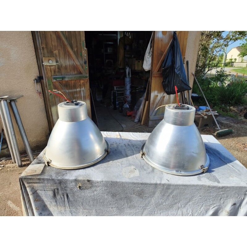 Pair of industrial pendant lights in aluminium and glass.