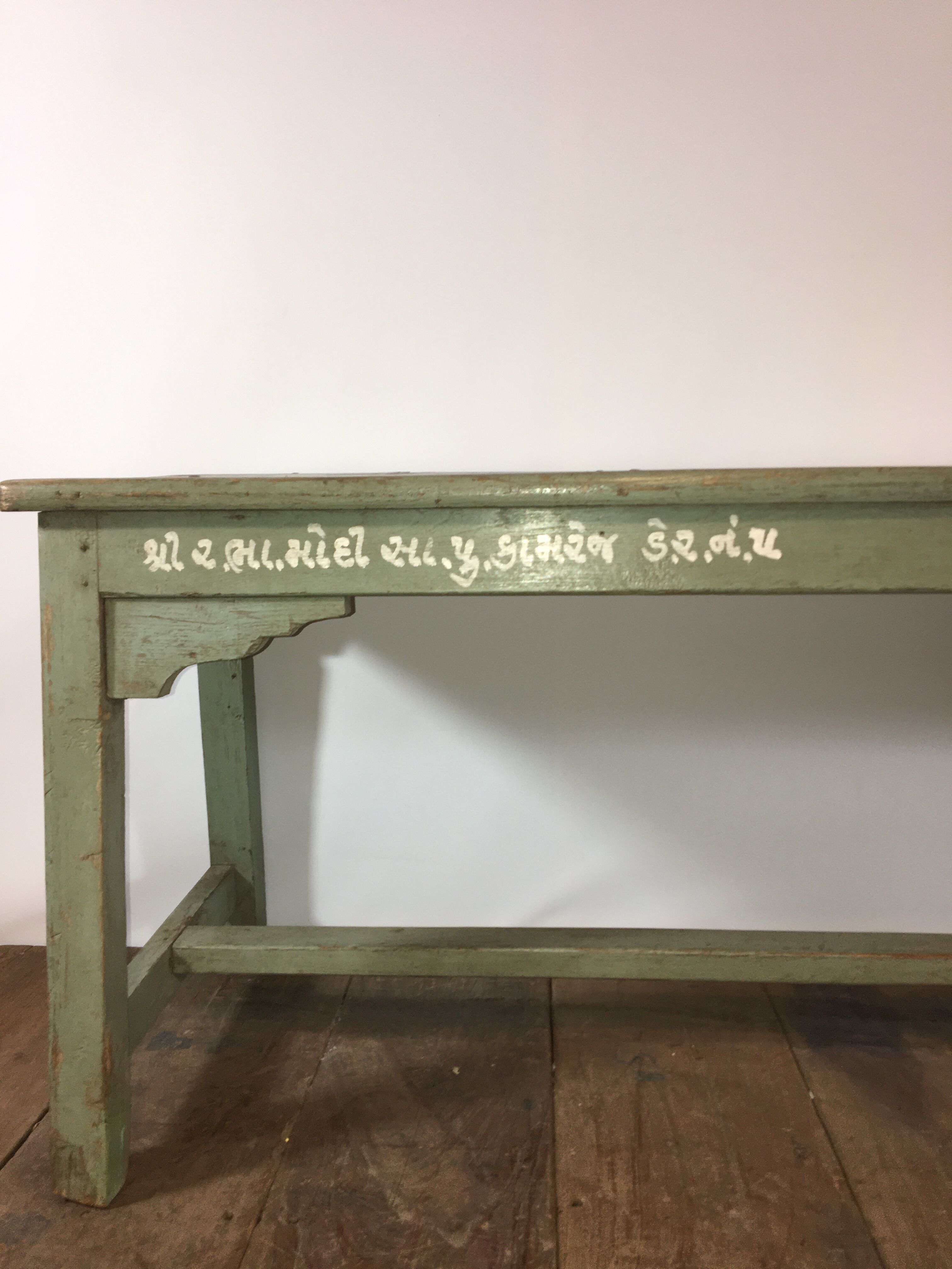 Grey lase wooden bench with inscriptions