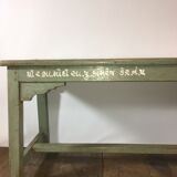 Grey lase wooden bench with inscriptions