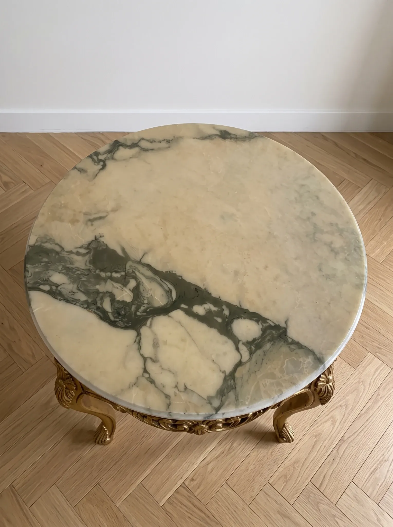 Baroque style coffee table with marble and gilded wood.