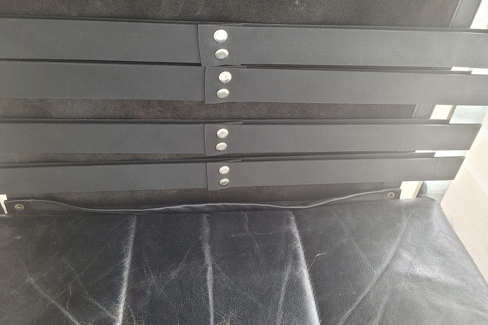 Pair of black leather loung chairs by Hans Eichenberger for Girsberger