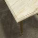 Marble coffee table with brass legs, height 46 cm.