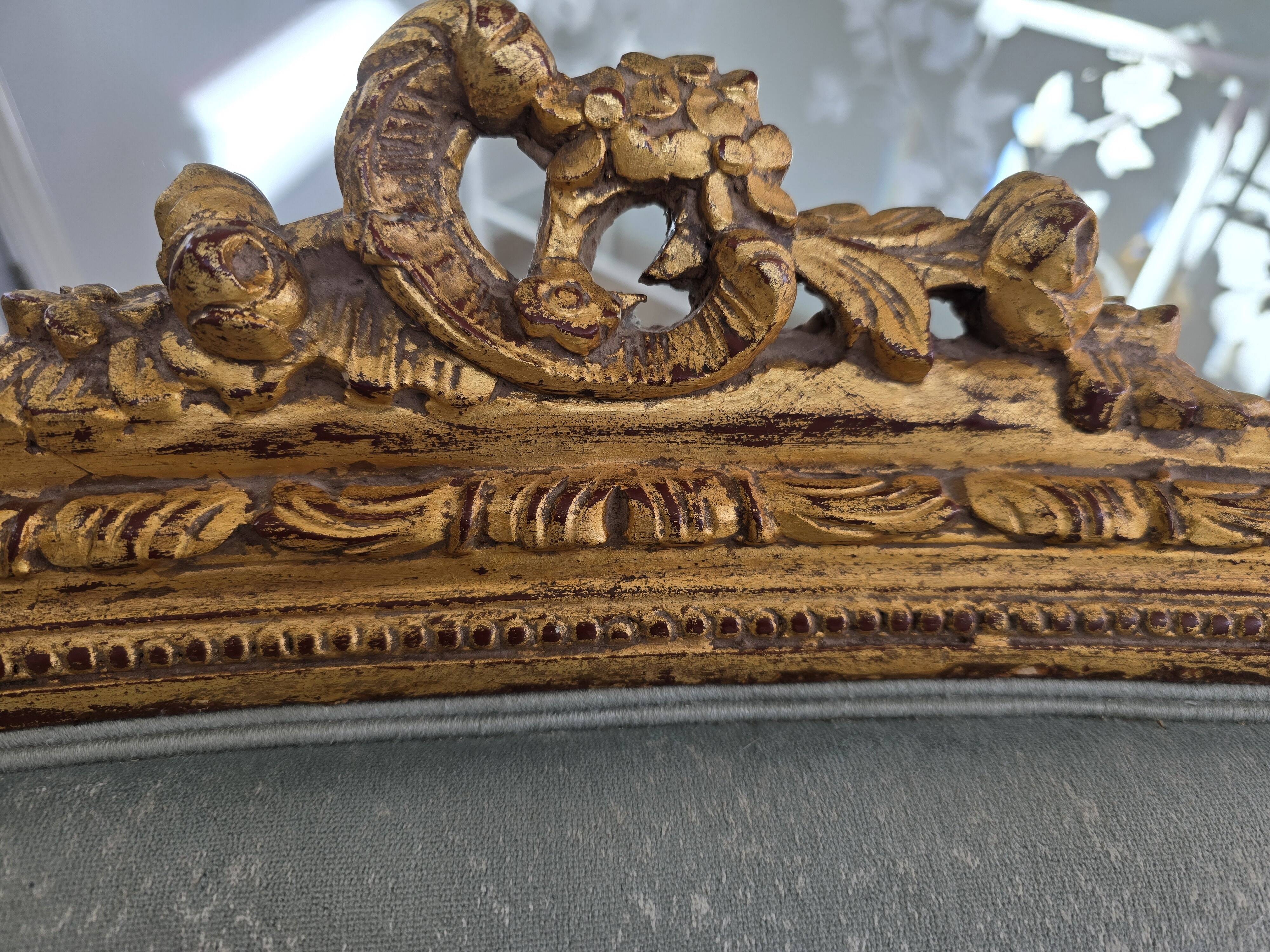 Louis XV gilt basket canapé with green velvet.