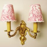 Pair of bronze sconces with four handmade toile de Jouy lampshades in France