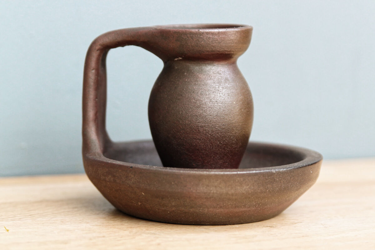 Small hand-held candlestick, signed