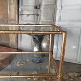 Console in gilded metal and glass